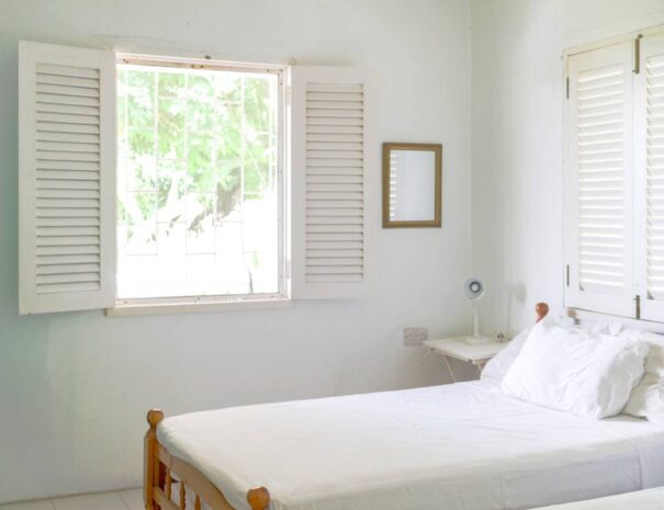 Bedroom #1 in Upper Apartment feature two twin beds that can easily convert into a King with a plush 4” gel & copper-infused topper, just let us know! Mosquito nets available by request. Screened windows, ceiling and pedestal fans.