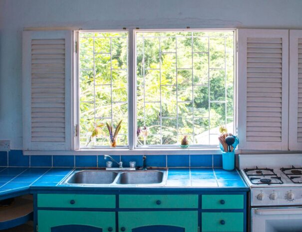 Ocean view apartment kitchen; includes microwave, blender, toaster, new coffee machines, a kettle and too many utensils.